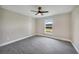 Bedroom with a ceiling fan and neutral wall paint at 13972 Chesswood Ln, Port Charlotte, FL 33981