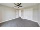 Bedroom features ceiling fan and double door closet at 13972 Chesswood Ln, Port Charlotte, FL 33981
