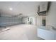 Spacious garage with epoxy floors, a service sink, and an insulated garage door at 13972 Chesswood Ln, Port Charlotte, FL 33981