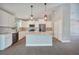 Bright and airy kitchen with white cabinetry, stainless steel appliances, and granite countertops at 13972 Chesswood Ln, Port Charlotte, FL 33981