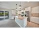 Modern kitchen with stainless steel appliances, granite countertops, and a large island at 13972 Chesswood Ln, Port Charlotte, FL 33981
