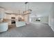 Beautiful kitchen featuring white cabinets, stainless steel appliances, and an island with pendant lighting at 13972 Chesswood Ln, Port Charlotte, FL 33981