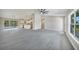 Expansive living area that combines the living room, dining area, and kitchen for open-concept living at 13972 Chesswood Ln, Port Charlotte, FL 33981