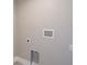 Shot of a wall in a home featuring hook-ups and neutral paint at 13972 Chesswood Ln, Port Charlotte, FL 33981