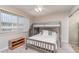 Bright bedroom with a bunk bed, large window, carpeted floor and ceiling fan with light at 150 Harborside Ave # 306, Punta Gorda, FL 33950