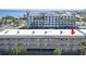 Multi-story condominium with white balconies and palm trees, providing waterfront access at 150 Harborside Ave # 306, Punta Gorda, FL 33950
