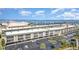 Waterfront condos with private parking and bay views, showcasing the building's facade in a tropical setting at 150 Harborside Ave # 306, Punta Gorda, FL 33950