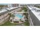 A serene pool and shuffleboard court create an ideal relaxing atmosphere within this inviting complex, surrounded by palm trees at 150 Harborside Ave # 306, Punta Gorda, FL 33950