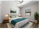 Bright bedroom featuring a ceiling fan, light hardwood floors, and natural light from the window at 15504 Melport Cir, Port Charlotte, FL 33981