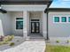 Inviting front entrance with double doors and manicured landscaping at 15504 Melport Cir, Port Charlotte, FL 33981