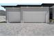 Two-car garage with brick paver driveway at 15504 Melport Cir, Port Charlotte, FL 33981