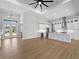 Open-concept kitchen flows into the living area, featuring an island and modern appliances at 15504 Melport Cir, Port Charlotte, FL 33981