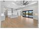 Open concept living room with a modern kitchen and access to the outdoor pool at 15504 Melport Cir, Port Charlotte, FL 33981