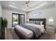 Main bedroom featuring a ceiling fan, recessed lighting, and sliding glass doors to the lanai at 15504 Melport Cir, Port Charlotte, FL 33981