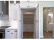 A kitchen pantry with open shelves and white cabinets, offering ample storage space at 15504 Melport Cir, Port Charlotte, FL 33981
