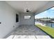 Covered outdoor patio with a ceiling fan and a view of the waterfront and private boat dock at 15504 Melport Cir, Port Charlotte, FL 33981