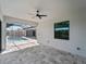 View of the outdoor living space, including a covered patio, screened pool, and well-manicured hardscape at 15504 Melport Cir, Port Charlotte, FL 33981