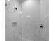 A modern shower with marble tile and a built-in niche at 15504 Melport Cir, Port Charlotte, FL 33981