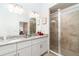 Bright bathroom with a double vanity, granite countertops and a sleek glass-enclosed shower at 15990 Grassland Ln # 3024, Punta Gorda, FL 33982