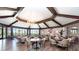 Elegant dining room with ample seating, stylish light fixtures, and views of the surrounding landscape at 15990 Grassland Ln # 3024, Punta Gorda, FL 33982
