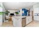 Open kitchen features a large island with sink, stainless steel dishwasher, and ample counter space at 15990 Grassland Ln # 3024, Punta Gorda, FL 33982