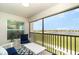 Inviting screened lanai with comfortable seating overlooking a picturesque lake and community landscape at 15990 Grassland Ln # 3024, Punta Gorda, FL 33982