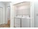 Convenient laundry closet with white washer and dryer units, maximizing space and functionality at 15990 Grassland Ln # 3024, Punta Gorda, FL 33982
