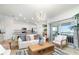 Open-concept living space with tile flooring, contemporary lighting, and seamless flow to the kitchen at 15990 Grassland Ln # 3024, Punta Gorda, FL 33982