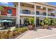 A vibrant outdoor shopping center with covered walkways, upscale eateries, and beautifully landscaped frontage at 17556 Winding Wood Ln, Punta Gorda, FL 33982