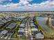 An aerial view shows a neighborhood featuring ponds, landscaping, and access to amenities at 17924 Corkwood Bend Trl, Punta Gorda, FL 33982