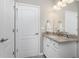 Bathroom featuring granite countertop vanity and modern fixtures, providing a clean aesthetic at 17924 Corkwood Bend Trl, Punta Gorda, FL 33982