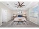 Spacious bedroom with tray ceilings, a large window, and neutral decor, offering a serene atmosphere at 17924 Corkwood Bend Trl, Punta Gorda, FL 33982