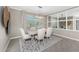 Cozy dining room with neutral tones, statement mirror, stylish lighting, and seating for six at 17924 Corkwood Bend Trl, Punta Gorda, FL 33982
