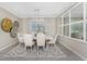 Beautiful dining area with statement chandelier and wall decor at 17924 Corkwood Bend Trl, Punta Gorda, FL 33982