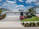 Charming single-Gathering home features a spacious two-car garage and beautiful, bright landscaping at 17924 Corkwood Bend Trl, Punta Gorda, FL 33982