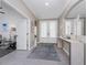 Elegant foyer featuring a modern console table, a large mirror, and neutral tile flooring at 17924 Corkwood Bend Trl, Punta Gorda, FL 33982