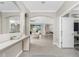 Hallway view showcasing archways that flow into the dining and living rooms at 17924 Corkwood Bend Trl, Punta Gorda, FL 33982