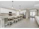 Spacious kitchen with breakfast bar, pendant lighting, and stainless appliances at 17924 Corkwood Bend Trl, Punta Gorda, FL 33982