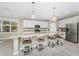Bright kitchen with large island, stainless appliances and eat-in breakfast bar at 17924 Corkwood Bend Trl, Punta Gorda, FL 33982