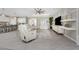 Bright, neutral living area with tile floors and ceiling fan at 17924 Corkwood Bend Trl, Punta Gorda, FL 33982