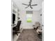 Bright home office featuring a ceiling fan, custom built-ins, and neutral colors at 17924 Corkwood Bend Trl, Punta Gorda, FL 33982