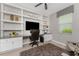 Cozy home office with custom shelving, granite countertop, and comfortable seating at 17924 Corkwood Bend Trl, Punta Gorda, FL 33982