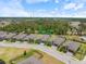 Aerial view of a well-maintained home on a manicured lot in an attractive neighborhood at 1993 E Isles Rd, Port Charlotte, FL 33953