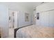 This bedroom features neutral tones, plenty of closet space, and an en-suite bathroom at 1993 E Isles Rd, Port Charlotte, FL 33953