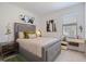 Comfortable bedroom featuring a cozy bed, stylish decor, and plenty of natural light at 1993 E Isles Rd, Port Charlotte, FL 33953