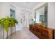 Welcoming foyer features decorative accents, a large mirror, and sightlines into the main living areas at 1993 E Isles Rd, Port Charlotte, FL 33953