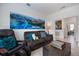 Comfortable living room with large windows, decorative art, and cozy seating at 1993 E Isles Rd, Port Charlotte, FL 33953
