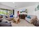 Inviting living room with comfortable seating, a unique coffee table, and a view to outdoor living at 1993 E Isles Rd, Port Charlotte, FL 33953