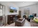 Relaxing living room space featuring a cozy fireplace, comfortable seating, and natural light at 1993 E Isles Rd, Port Charlotte, FL 33953