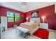 Elegant main bedroom with rich colors, a chandelier, and luxury furniture at 1993 E Isles Rd, Port Charlotte, FL 33953